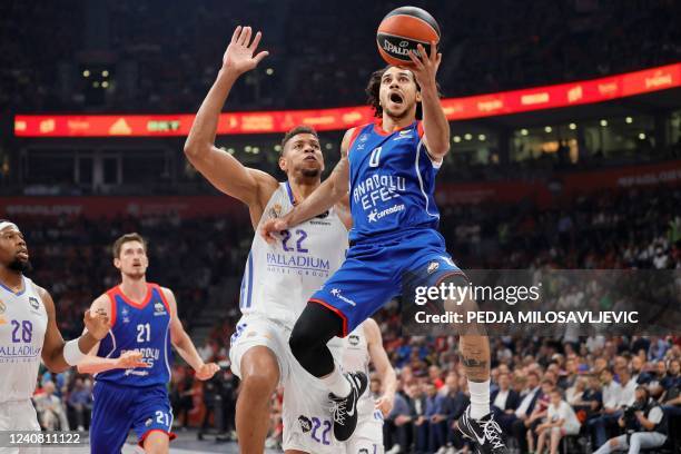 Anadolu Efes' Shane Larkin goes for the basket past Real Madrid's Walter Tavares during the EuroLeague Final Four final basketball match between Real...