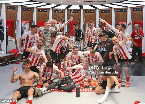 Sunderland players and staff celebrate in the dressing room following the Sky Bet League One Play-Off Final match between Sunderland and Wycombe...