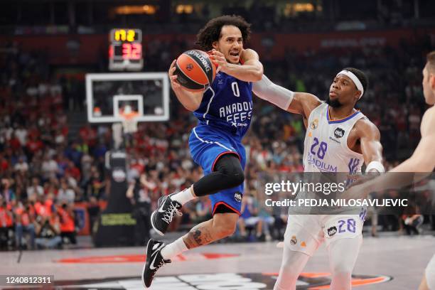 Anadolu Efes' Shane Larkin moves past Real Madrid's Guerschon Yabusele during the EuroLeague Final Four final basketball match between Real Madrid...