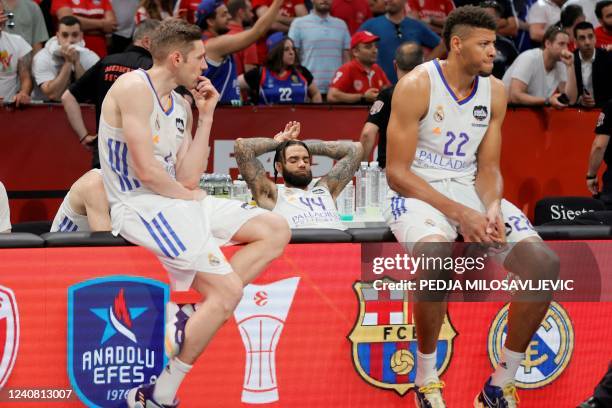 Real Madrid's Fabien Causeur , Jeffery Taylor and Walter Tavares react at the end of the EuroLeague Final Four final basketball match between Real...