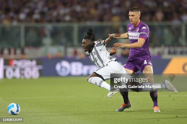 Nikola Milenkovic of ACF Fiorentina battles for the ball with Moise Bioty Kean of Juventus during the Serie A match between ACF Fiorentina and...