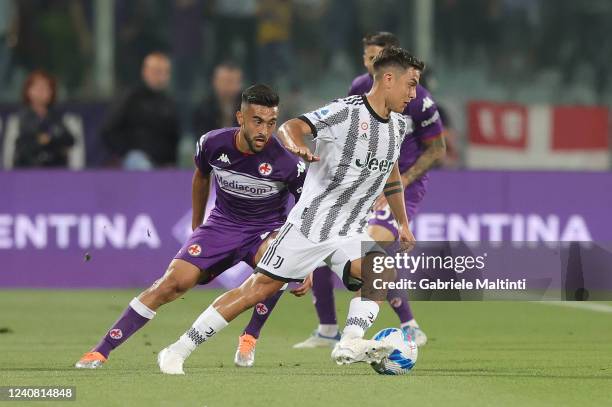 Paulo Exequiel Dybala of Juventus in action against Nicolas Gonzalez of ACF Fiorentina during the Serie A match between ACF Fiorentina and Juventus...