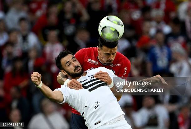 Rennes' forward Gaetan Laborde and Lille's defender Jose Fonte fight for the ball during the French L1 football match between Lille OSC and Stade...