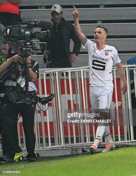 Rennes' French midfielder Benjamin Bourigeaud celebrates after he scored a goal during the French L1 football match between Lille OSC and Stade...