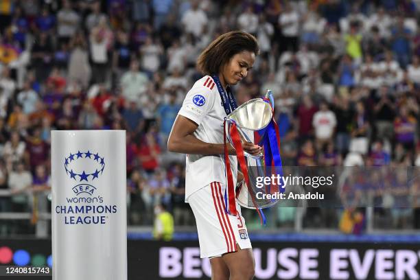 Wendie Renard, captain of Olympique Lyonnais, holds the trophy at the end of the Women Champions League football match between Olympique Lyonnais and...