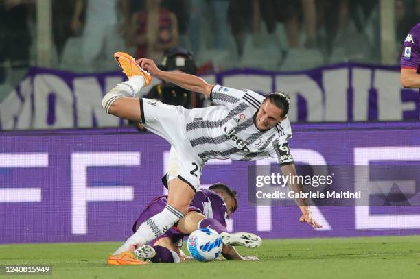 Adrien Rabiot of Juventus and Lorenzo Venuti of ACF Fiorentina during the Serie A match between ACF Fiorentina and Juventus at Stadio Artemio Franchi...