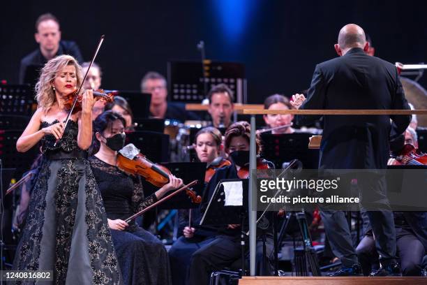 May 2022, Mecklenburg-Western Pomerania, Peenemünde: The New York Philharmonic Orchestra, led by conductor Jaap van Zweden , performs together with...
