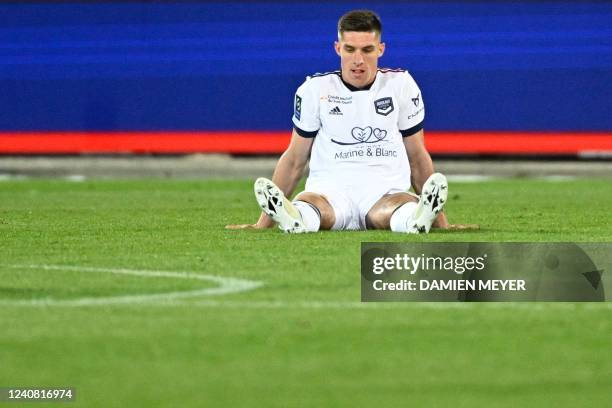 Bordeauxs Ukrainian midfielder Danylo Ignatenko sits on the pitch following during the French L1 football match between Stade Brestois 29 and...