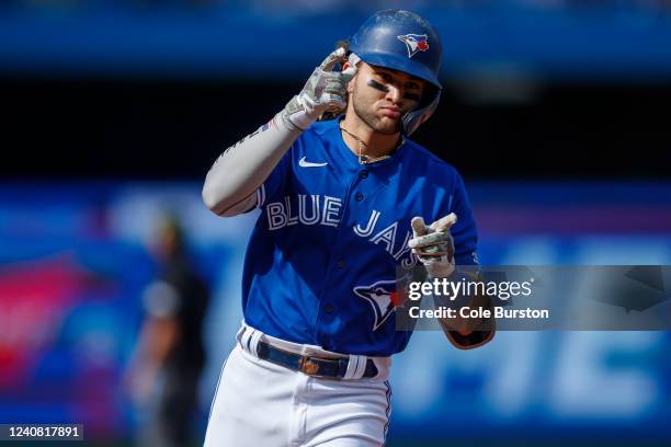 Bo Bichette of the Toronto Blue Jays runs out a two-run home run in the seventh inning of their MLB game at Rogers Centre on May 21, 2022 in Toronto,...