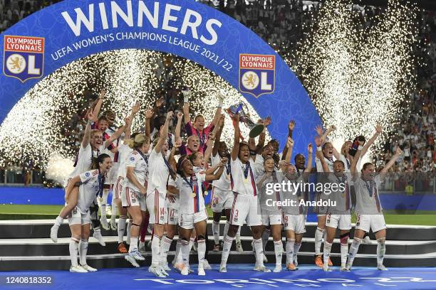 Wendie Renard , of Olympique Lyonnais, holds up the trophy at the end of their Women Champions League football match against Barcelona at Juventus...