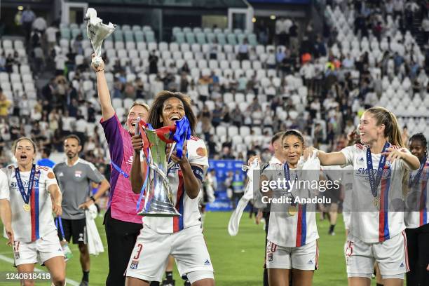 Wendie Renard , of Olympique Lyonnais, holds the trophy at the end of their Women Champions League football match against Barcelona at Juventus...