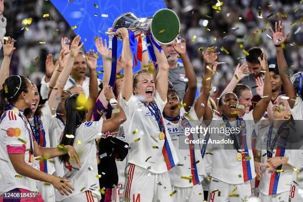 Catarina Macario , of Olympique Lyonnais, holds up the trophy at the end of their Women Champions League football match against Barcelona at Juventus...