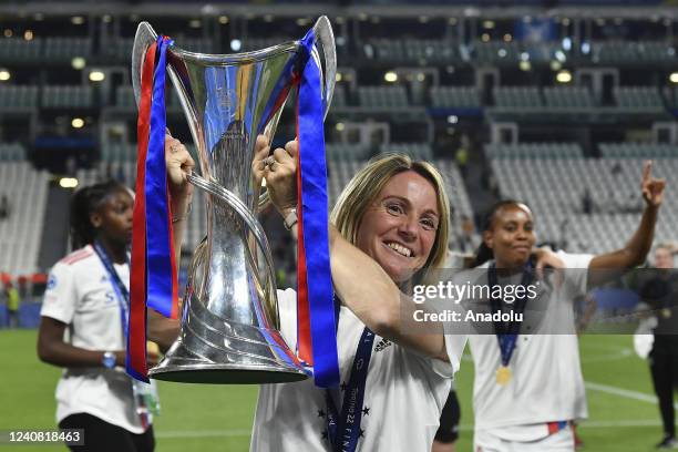 Sonia Bompastor, head coach of Olympique Lyonnais, holds the trophy at the end of their Women Champions League football match against Barcelona at...