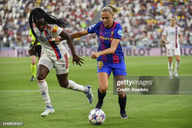 Fridolina Rolfo , of Barcelona, is challenged by Melvine Malard , of Olympique Lyonnais, during the Women Champions League football match between...