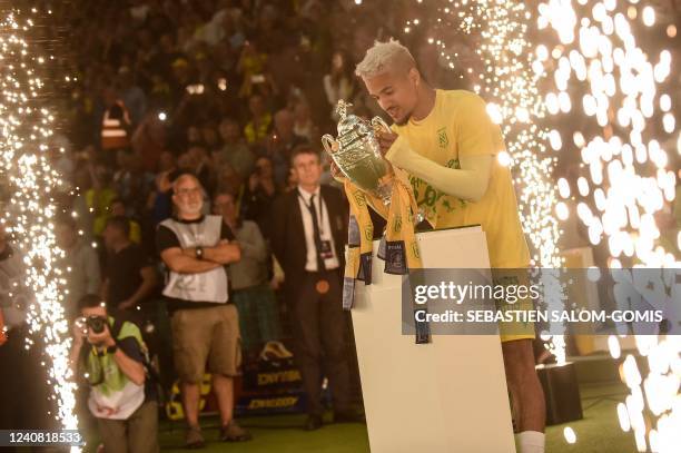 Nantes' French midfielder Ludovic Blas looks at the French cup after the French L1 football match between FC Nantes and AS Saint-Etiennes at the...