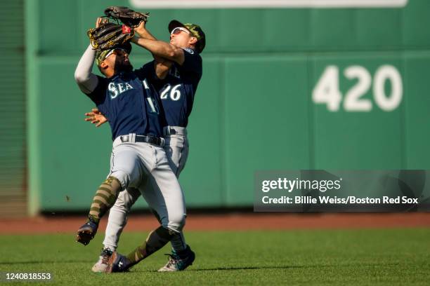 Adam Frazier of the Seattle Mariners collides with teammmage Abraham Toro as they attempt to catch a fly ball during the first inning of a game...