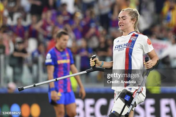 Ellie Carpenter, of Olympique Lyonnais, walks on crutches at the end of their Women Champions League football match against Barcelona at Juventus...