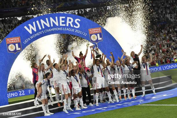 Wendie Renard , of Olympique Lyonnais, holds up the trophy at the end of their Women Champions League football match against Barcelona at Juventus...