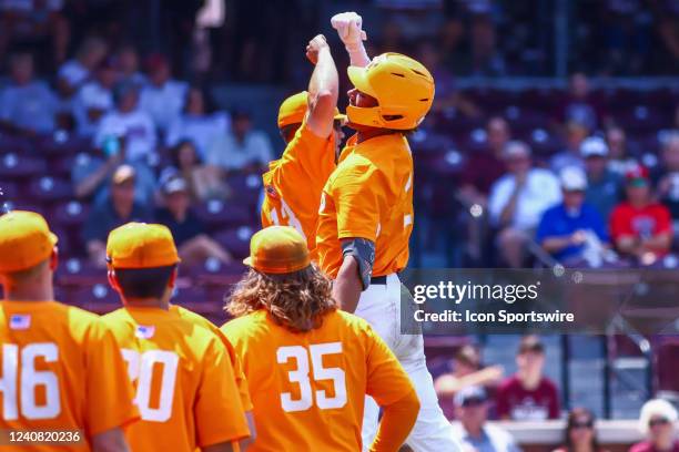 Tennessee Volunteers players celebrate a home run during the game between the Mississippi State Bulldogs and the Tennessee Volunteers on May 21, 2022...