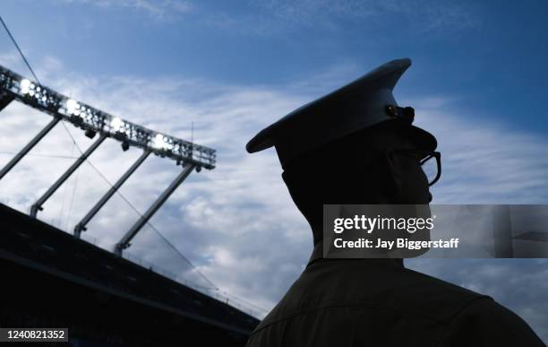 Marine looks on during a pregame ceremony commemorating Armed Forces Day before a game between the Kansas City Royals and the Minnesota Twins at...