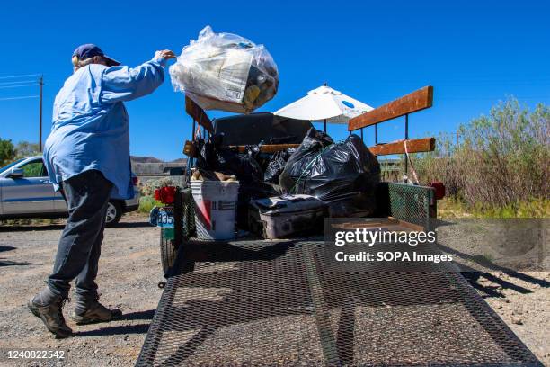 Trash tossed in the back of a trailer after being cleaned up from a trail head in Mustang Ranch Trail. Volunteers gathered at the Truckee River at...