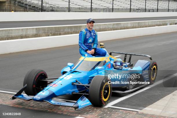 IndyCar driver Jimmie Johnson poses for a photo with his car on May 21st, 2022 after qualifying for the 106th running of the Indianapolis 500 at the...