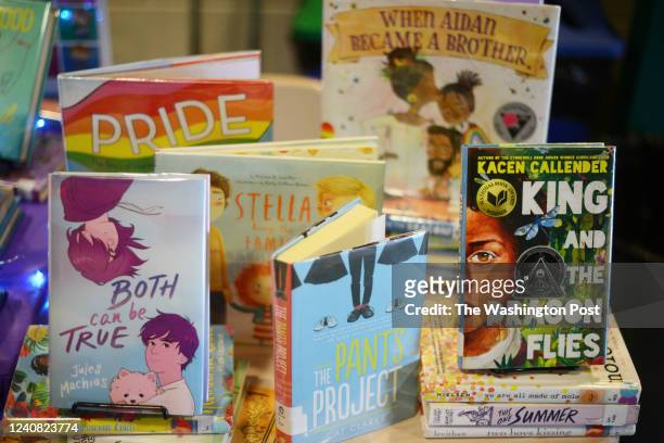Children books that are fighting for survival at public schools because of their LGBTQ content are displayed at the annual Pride Town Hall at Walter...