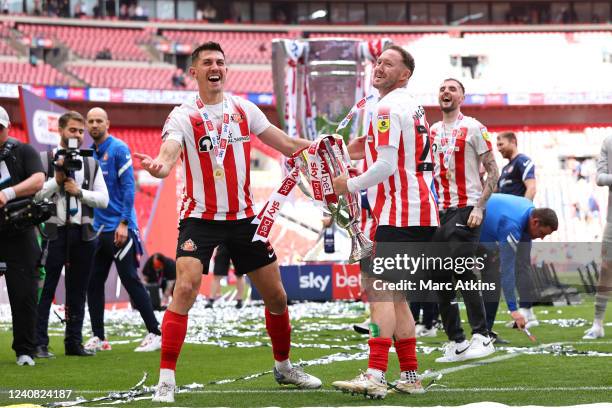 Danny Batth and Aiden McGeady of Sunderland celebrate promotion to the championship with the trophy during the Sky Bet League One Play-Off Final...