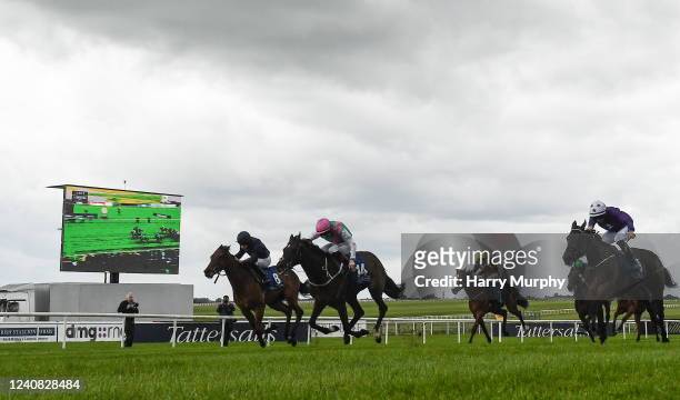 Kildare , Ireland - 22 May 2022; Zarinsk, with Colin Keane up cross the line ahead of Never Ending Story, with Ryan Moore up, to win the Tally Ho...