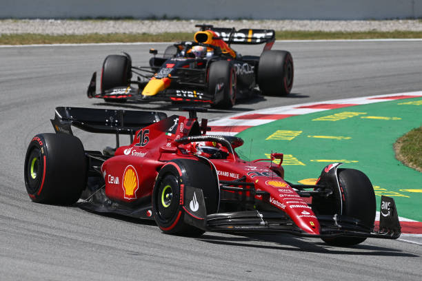 TOPSHOT - Ferrari's Monegasque driver Charles Leclerc drives ahead of Red Bull's Dutch driver Max Verstappen during the Spanish Formula One Grand Prix at the Circuit de Catalunya on May 21, 2022 in Montmelo, on the outskirts of Barcelona.