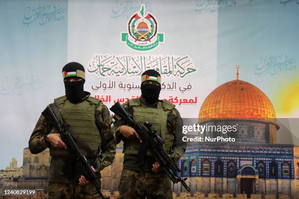 Palestinian militants from the joint operations room of the Palestinian resistance factions attend the national conference on the first anniversary...