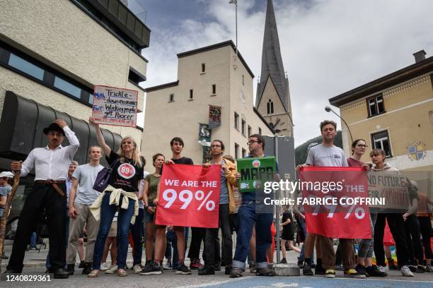 Protesters take part in a demonstration against the World Economic Forum during the WEF annual meeting in Davos on May 22, 2022.