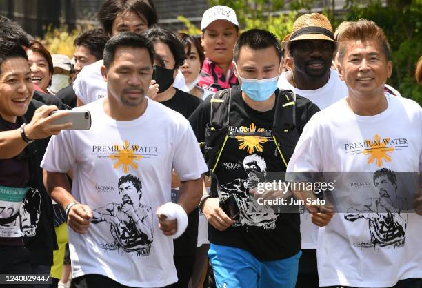 Manny Pacquiao and Kunikazu Katsumata attend the charity marathon event to provide shelters for the children in the Philippines at City Football...