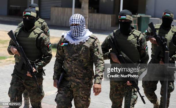 Palestinian militants from the joint operations room of the Palestinian resistance factions attend the national conference on the first anniversary...