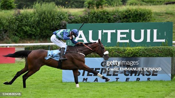 Johnny Charron rides Sel Jem during the 144th edition of the 'Grand Steeple-Chase de Paris' Group 1 steeplechase horse race at The Auteuil Hippodrome...