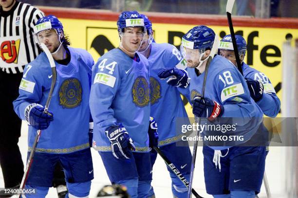 Kazakhstan players celebrate scoring during the 2022 IIHF Ice Hockey World Championships preliminary round group A match between Kazakhstan and...