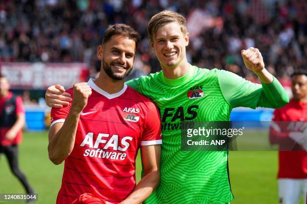 Pantelis Hatzidiakos of AZ Alkmaar and AZ Alkmaar goalkeeper Peter Vindahl-Jensen celebrate the victory during the Dutch premier league play-offs...