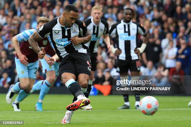 Newcastle United's English striker Callum Wilson scores the opening goal from the penalty spot during the English Premier League football match...