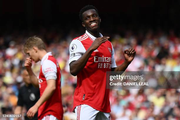 Arsenal's English striker Eddie Nketiah reacts after missing a goal opportunity during the English Premier League football match between Arsenal and...