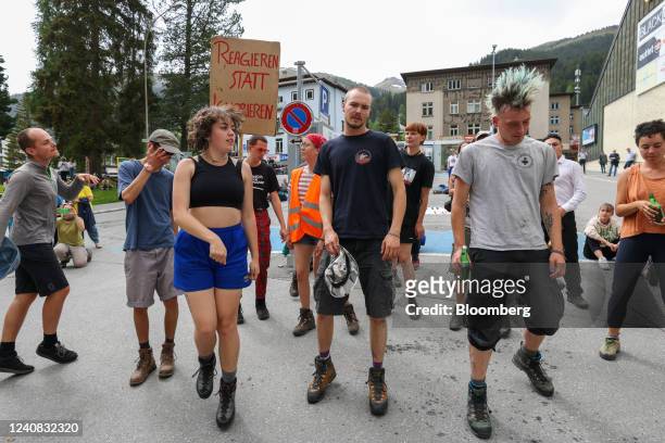 Protesters dance to a live band ahead of the World Economic Forum in Davos, Switzerland, on Sunday, May 22, 2022. The annual Davos gathering of...