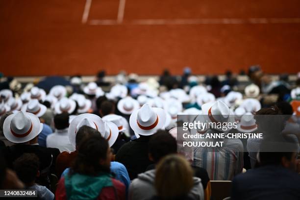 Spectators watch the men's singles match between Peru's Juan Pablo Varillas and Canada's Felix Auger-Aliassime on day one of the Roland-Garros Open...