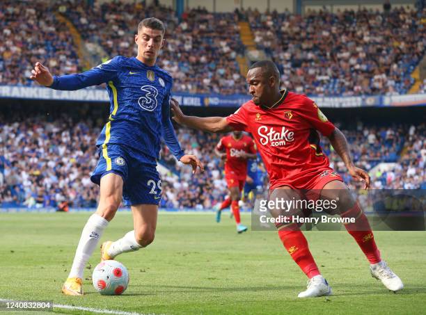 Kai Havertz of Chelsea is held up by Samir of Watford during the Premier League match between Chelsea and Watford at Stamford Bridge on May 22, 2022...