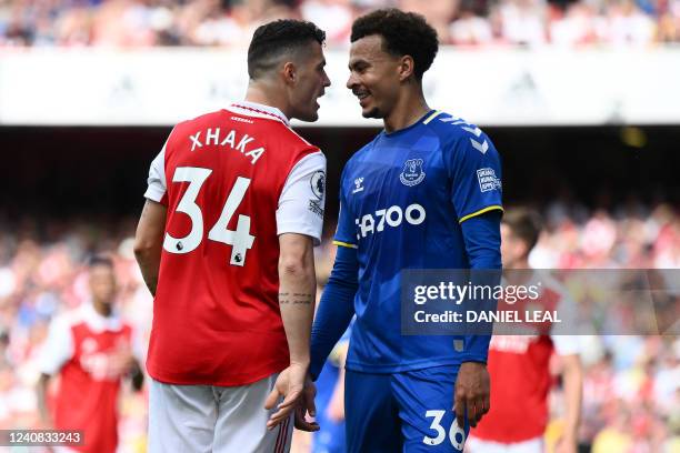 Arsenal's Swiss midfielder Granit Xhaka speaks to Everton's English midfielder Dele Alli during the English Premier League football match between...