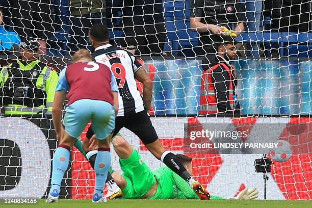 Newcastle United's English striker Callum Wilson scores their second goal during the English Premier League football match between Burnley and...