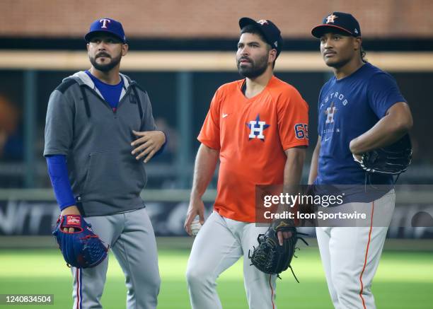 Texas Rangers starting pitcher Martin Perez chats with Houston Astros starting pitcher Jose Urquidy and Houston Astros starting pitcher Luis Garcia...