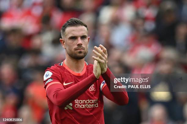Liverpool's English midfielder Jordan Henderson reacts at the end of the English Premier League football match between Liverpool and Wolverhampton...