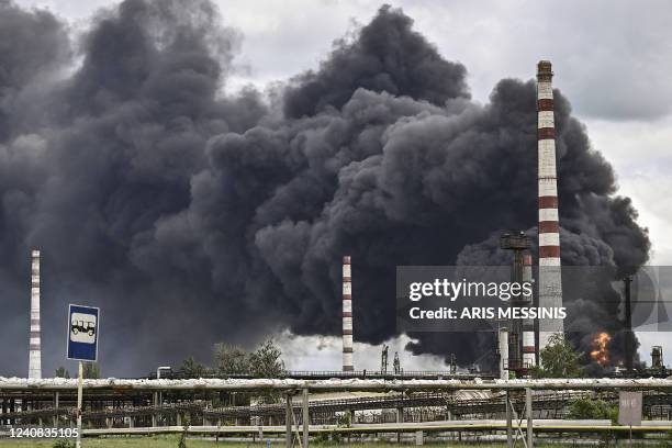 Smoke rises from an oil refinery after an attack outside the city of Lysychans'k in the eastern Ukranian region of Donbas, on May 22 on the 88th day...