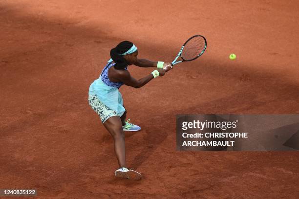 Coco Gauff plays a backhand return to Canada's Rebecca Marino during their women's singles match on day one of the Roland-Garros Open tennis...