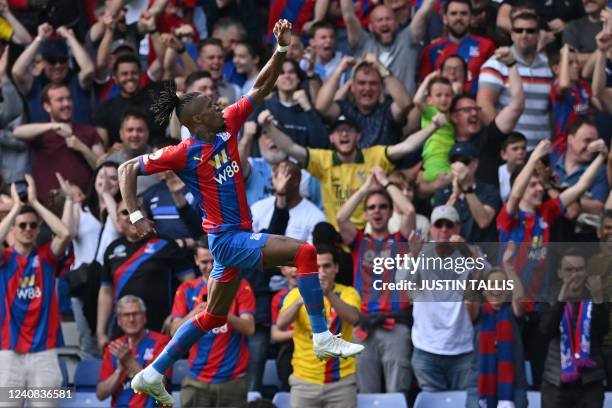 Crystal Palace's Ivorian striker Wilfried Zaha celebrates after scoring the opening goal during the English Premier League football match between...