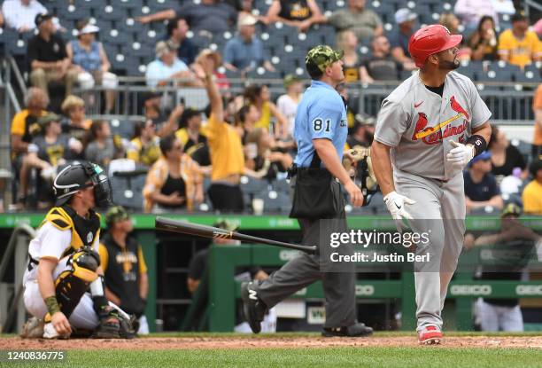 Albert Pujols of the St. Louis Cardinals tosses his bat after hitting a solo home run in the fifth inning during the game against the Pittsburgh...